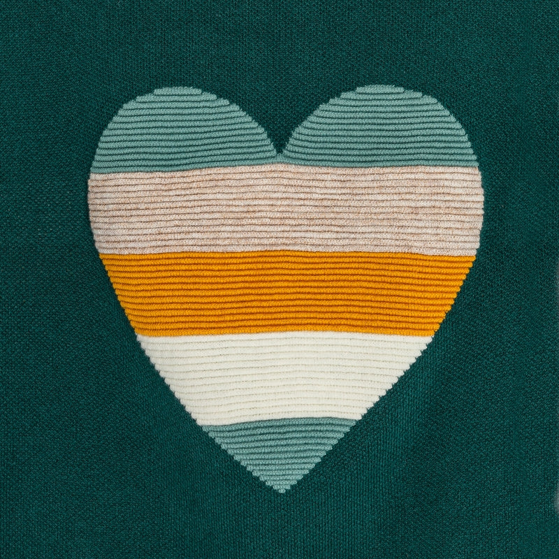 Green sweater with girl's heart pattern